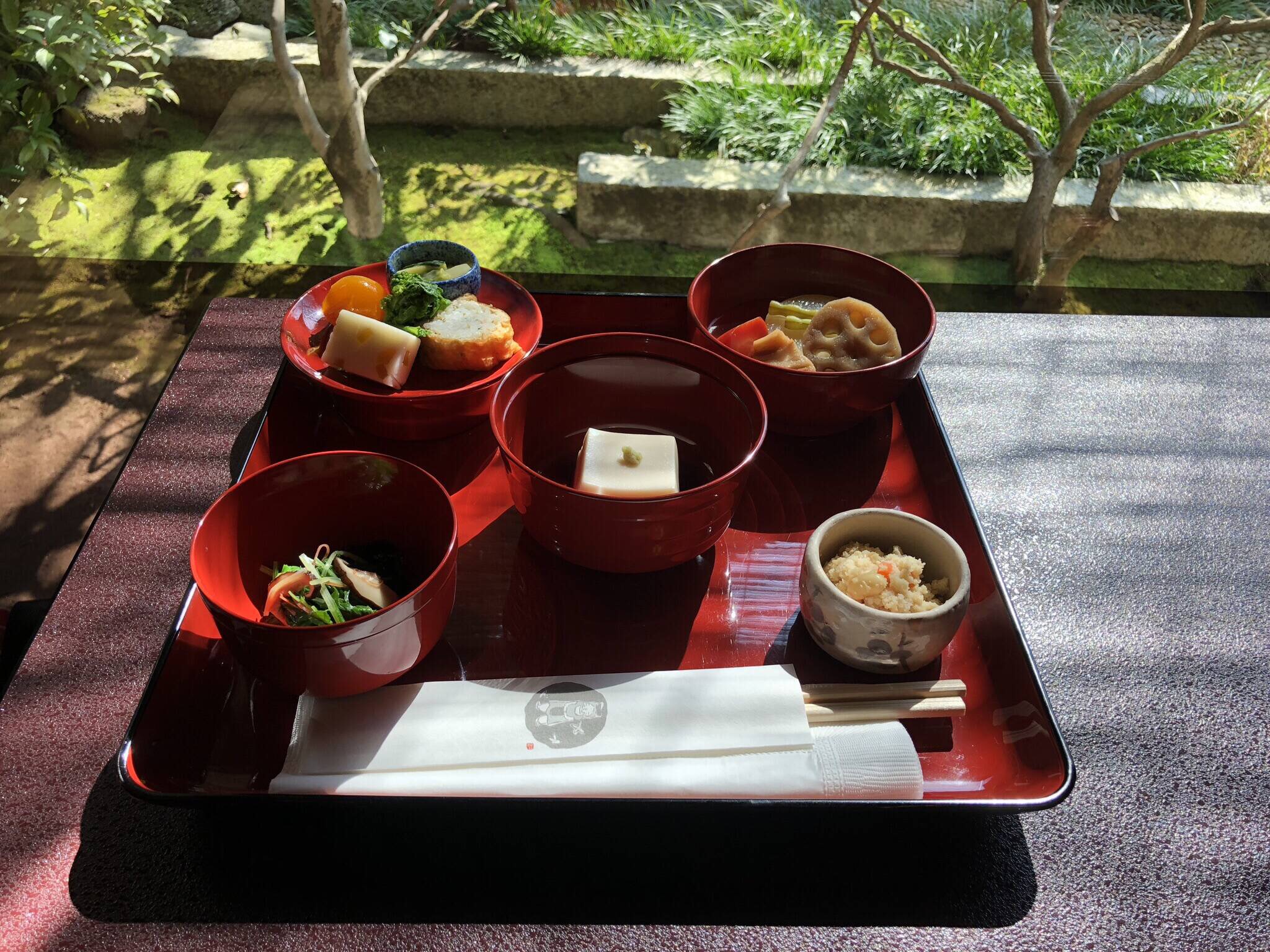 Shojin ryori in red bowls on red platter